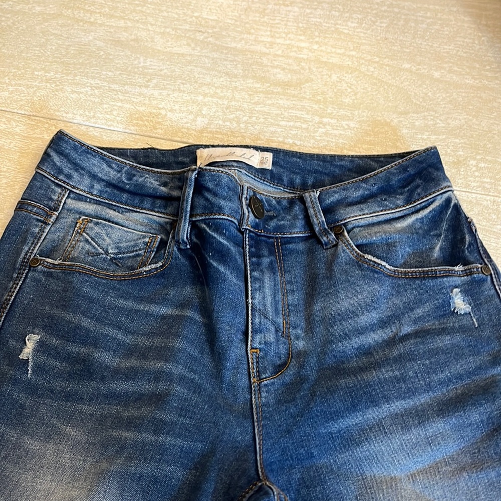 Unpublished ripped blue jeans